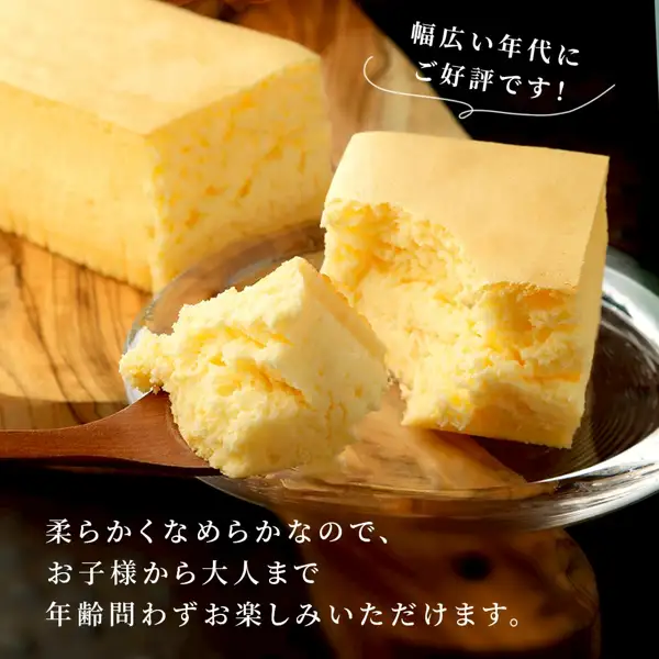 クリオロ 幻のチーズケーキ レクタ的商品照片：露出切面的长方形蛋糕、木勺上的一口分，以及玻璃盘中吃了一部分的一块。店铺加在图片中的标示（日文原文）：「幅広い年代にご好評です！」「柔らかくなめらかなので、お子様から大人まで年齢問わずお楽しみいただけます。」