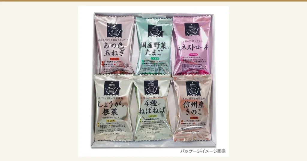 Featured image for アスザックフーズ Soup Tasting Set with 20 Kinds of Vegetables and Mushrooms (6 Servings). Individually wrapped pouches of six freeze-dried soups are lined up in a white box, three on the top row and three on the bottom. Each pouch, in a different metallic color, carries the “ASUZAC FOODS” and “スープ生活” (Soup Life) logos. From the top left the labels read “国産玉ねぎと自家製チキンブイヨン” (domestic onions and homemade chicken bouillon) “あめ色玉ねぎ” (caramelized onion), “国産野菜とたまご” (domestic vegetables and egg) and “9種の野菜のうまみ” (flavor of 9 kinds of vegetables) “ミネストローネ” (minestrone); on the bottom row from the left “鰹だしと3種の国産生姜” (bonito stock and 3 kinds of domestic ginger) “しょうがと根菜” (ginger and root vegetables) “生姜固形分0.19g/食” (ginger solids 0.19 g per serving), “昆布出汁と梅のうまみ” (kelp stock and ume plum flavor) “4種のねばねば” (4 kinds of sticky vegetables) and “きのこ出汁と柚子胡椒” (mushroom stock and yuzu pepper) “信州産きのこ” (Shinshu mushrooms). The pouches also show “つくり方” (how to make), “カップに中身を入れます。” (put the contents in a cup), “熱湯160mlを①の上から注ぎ、よくかき混ぜ、約1分でできあがります。” (pour 160 ml of boiling water over it, stir well, and it is ready in about 1 minute) and “フリーズドライ製法” (freeze-dried). At the bottom right, the text “パッケージイメージ画像” (package image for illustration) appears as a display the seller placed in the image.
