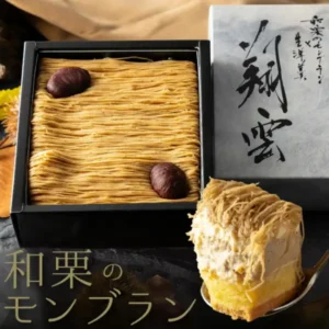 Product photo of Kasho Morin Waguri Mont Blanc: a Mont Blanc in a black box, with finely piped chestnut cream topped with two chestnuts. A gray outer box with brushed characters “翔雲” stands at the right, and a cross-section of the cake on a spoon is at the lower right. Text the shop placed in the image at the lower left: “和栗のモンブラン” (Waguri Mont Blanc)