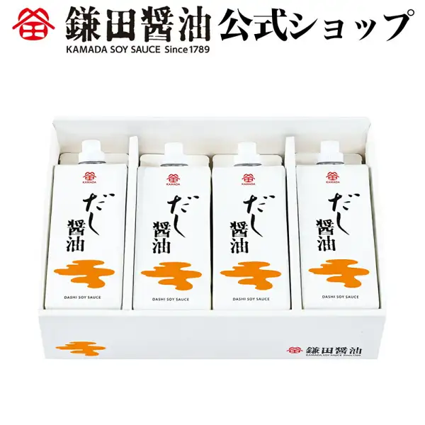 Product photo of 鎌田醤油 Dashi Shoyu 500ml × 4: four white cartons with white screw caps stand in the dividers of a white gift box; each carton has an orange cloud-shaped pattern and the text “だし醤油”, “DASHI SOY SAUCE” and “KAMADA”. The box has the “鎌田醤油” and “KAMADA SOY SAUCE Since1789” logo at the lower right. Text the shop placed in the image: “鎌田醤油 公式ショップ” and “KAMADA SOY SAUCE Since1789”.