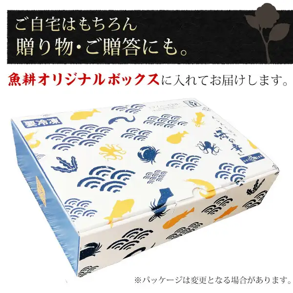 Product photo of the original box for Uoko Crab Cream Croquettes, 6 Large Pieces: a white box printed with blue wave patterns and yellow and navy seafood illustrations, with “要冷凍” (keep frozen) at the upper left of the box. Text the shop placed in the image reads: “ご自宅はもちろん 贈り物・ご贈答にも。” (for home and also for gifts), “魚耕オリジナルボックスに入れてお届けします。” (delivered in the Uoko original box) and “※パッケージは変更となる場合があります” (the package may change).