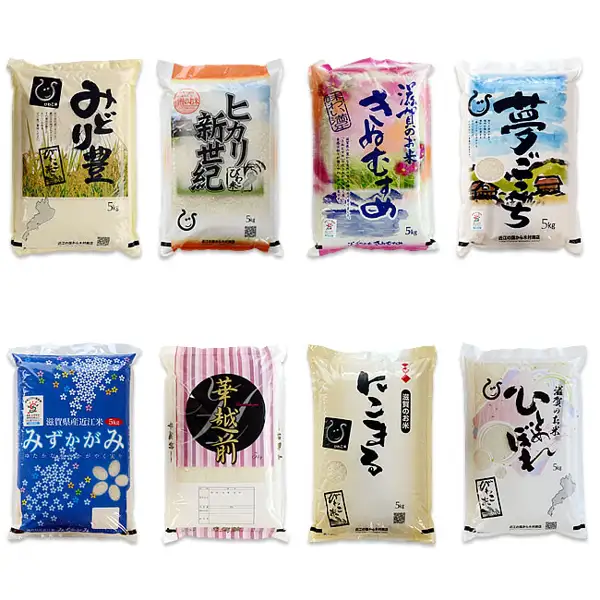 Product photo of eight 5kg rice bags of different varieties in two rows. Text the shop placed on the bags includes the variety names 「みどり豊」, 「ヒカリ新世紀」, 「きぬむすめ」, 「夢ごこち」, 「みずかがみ」, 「華越前」, 「にこまる」 and 「ひとめぼれ」. An example of the varieties of Kimura Shoten Shiga-Grown Fukubukuro Rice 10kg.