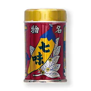 Product photo of a shichimi chili pepper blend tin: a red tin with the characters “名物 七味” (famous shichimi) and a gold lid (八幡屋礒五郎 Shichimi Tin 14g)
